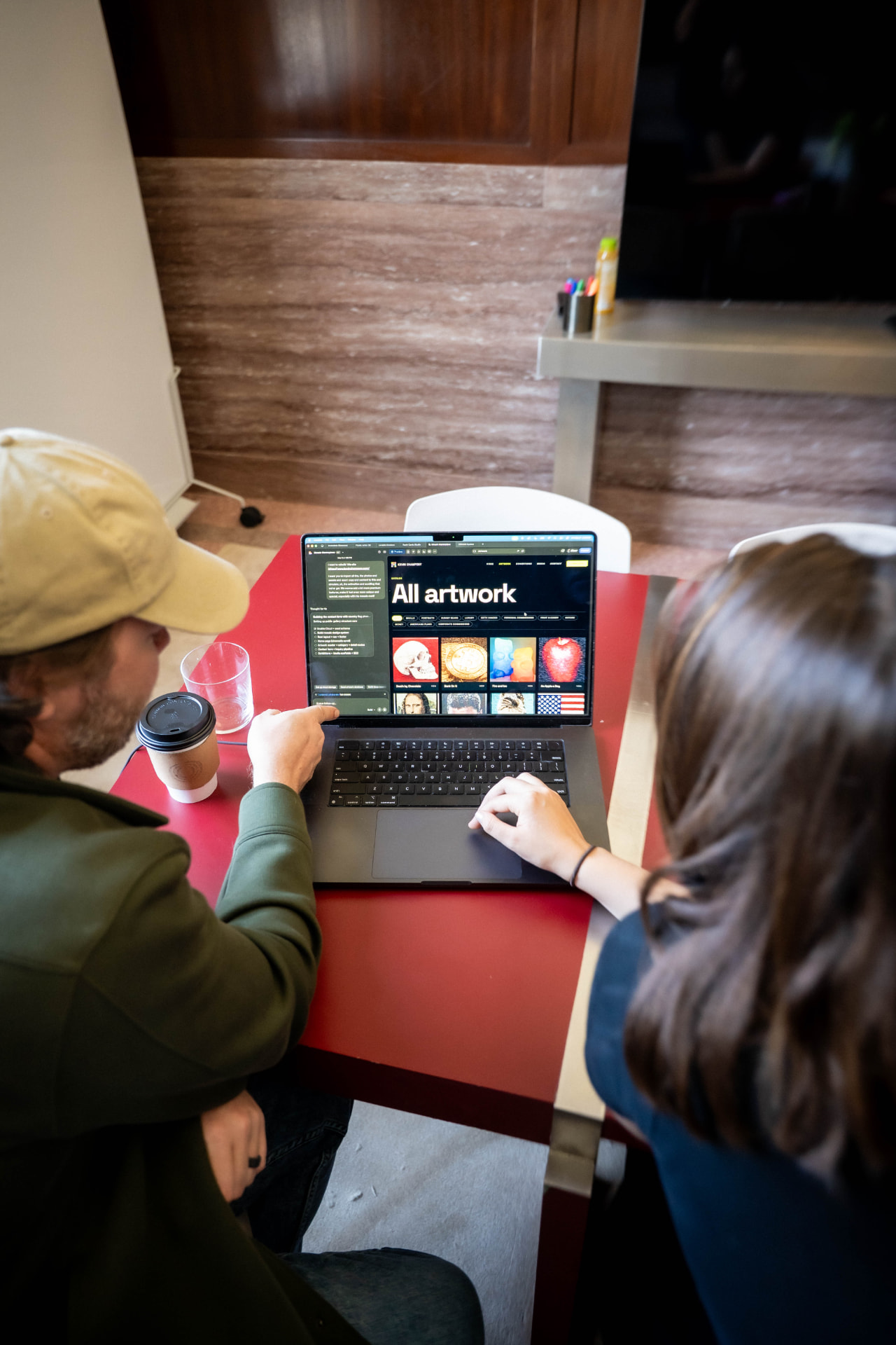 Building a client site together on a laptop during a CoBuild session